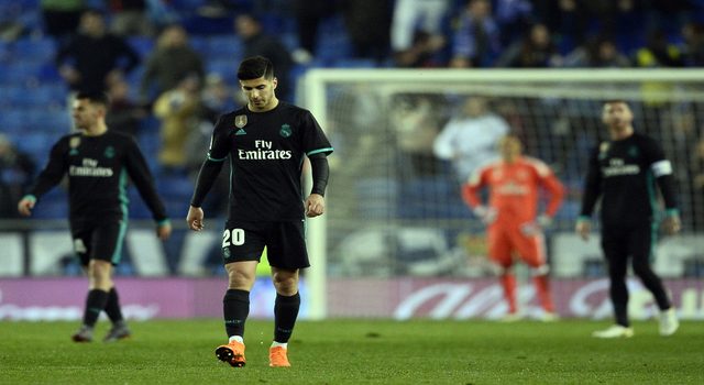 Real Madrid's Spanish midfielder Marco Asensio walks on the field after Espanyol's goal during the Spanish league football match between RCD Espanyol and Real Madrid CF at the RCDE Stadium in Cornella de Llobregat on February 27, 2018. / AFP PHOTO / Josep LAGO (Photo credit should read JOSEP LAGO/AFP/Getty Images)