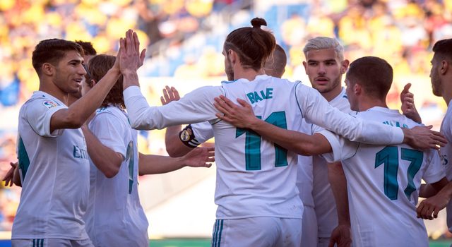 Real Madrid's Welsh forward Gareth Bale (C) celebrates a goal with teammates during the Spanish League football match between UD Las Palmas and Real Madrid CF at the Gran Canaria stadium in Las Palmas on March 31, 2018. / AFP PHOTO / DESIREE MARTIN (Photo credit should read DESIREE MARTIN/AFP/Getty Images)