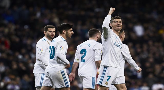 MADRID, SPAIN - MARCH 18: Cristiano Ronaldo of Real Madrid CF celebrates scoring their third goal with teammates during the La Liga match between Real Madrid CF and Girona FC at Estadio Santiago Bernabeu on March 18, 2018 in Madrid, Spain. (Photo by Gonzalo Arroyo Moreno/Getty Images)